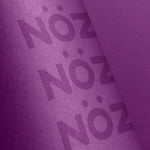 Load image into Gallery viewer, Neon purple Nöz SPF with purple background
