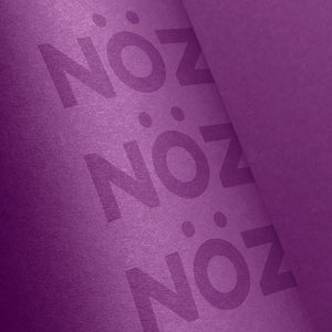 Neon purple Nöz SPF with purple background